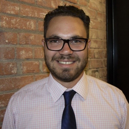 photo of a white male with glasses