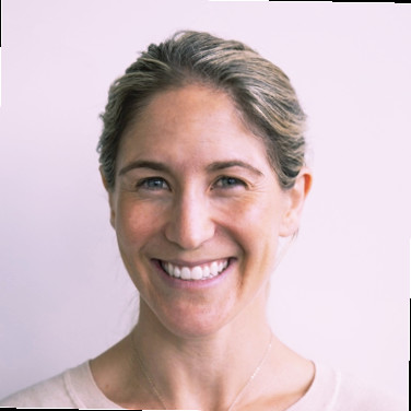 headshot of a smiling woman