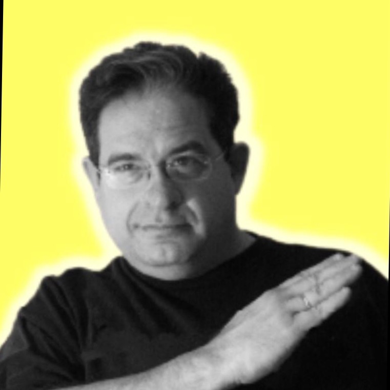 photo of a man in black tshirt and yellow background